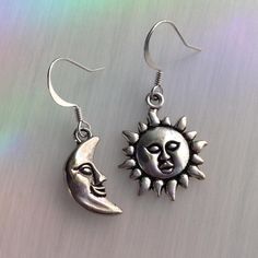 Tibetan silver sun and moon charms, on your choice of ear hooks * Fish hook * Lever back * Kidney (47mm, will fit through stretched ear tunnels) * Post-style * Clip on (non-piercing)  * Sterling Silver Fish hooks ..: V I E W   S H O P:.. www.lotusfairy.etsy.com www.shopEarthshine.com ..: P O L I C I E S :.. Please see the drop down FAQs menu All items are FINAL SALE. ★ I M P O R T A N T ★ This product is not intended to be used by, or around,  anyone under the age of 13.  ShopEarthshine.com ★ lotusfairy.etsy.com  Canadian buyers:  Prices shown include GST/HST. Silver Earrings With Sun And Moon Design - Symbolic, Silver Symbolic Earrings With Sun And Moon Design, Trendy Silver Moon-shaped Earrings, Trendy Silver Moon Earrings, Symbolic Silver Earrings With Sun And Moon Design, Adjustable Sun And Moon Sterling Silver Earrings, Adjustable Sterling Silver Earrings With Sun And Moon Design, Adjustable Sterling Silver Sun And Moon Earrings, Sterling Silver Sun And Moon Adjustable Earrings