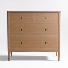 the chest of drawers is made from wood and has four drawers, one with two handles