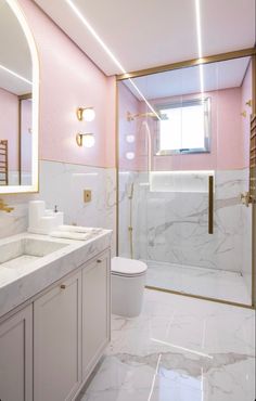 a bathroom with marble floors and pink walls