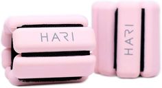 two pink hair brushes sitting next to each other on a white surface with the words hari written on them