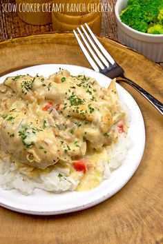 a white plate topped with chicken covered in gravy