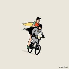 a man riding on the back of a bike next to a woman wearing a cape