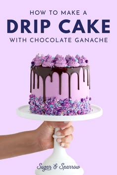 a hand holding a cake with chocolate ganache on it and the words how to make a drip cake with chocolate ganache