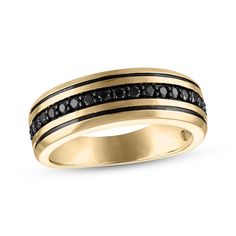 an 18k yellow gold ring with black diamonds