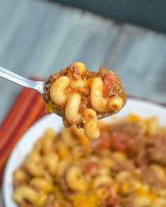 a spoon full of chili macaroni and cheese