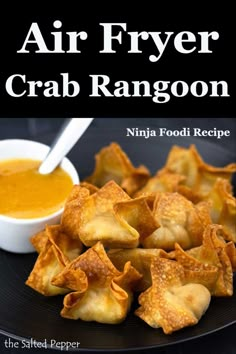 an air fryer crab rangoon recipe on a plate with dipping sauce in the background