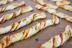 there are many pieces of food on the baking sheet ready to be baked in the oven