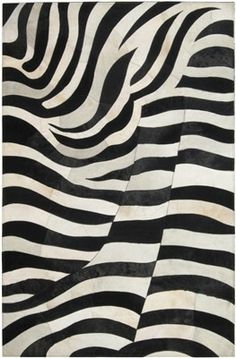 an animal print rug with black and white stripes