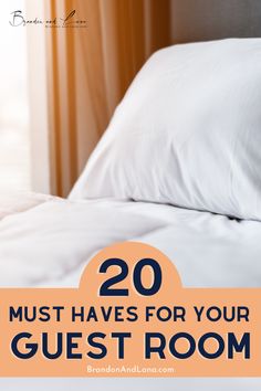 a bed with white pillows and the words 20 must haves for your guest room