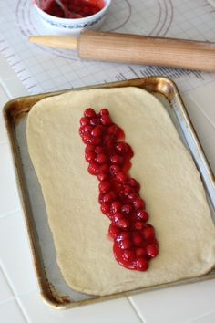 the dough is ready to be baked with raspberries