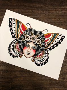 a card with an image of a woman's face and butterfly wings on it