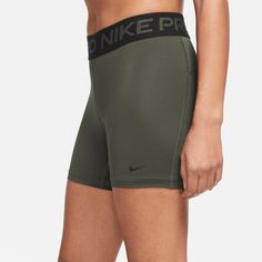 Style No. CZ9831-325 Color: Cargo Khaki/Black The Nike Pro 365 Shorts wrap you in stretchy fabric with Dri-FIT technology to keep you feeling supported and dry during intense workouts. Tight fit for a body-hugging feel. 5-inch Inseam. 83% polyester/17% spandex. Nike Pro 365 Women's 5" Shorts. Red Nike Pros, Nike Spandex, Nike Tempo Shorts, Black Nike Shorts, Workout Shorts Women, Nike Pro Shorts, Nike Athletic Shorts, Nike Sweats, Black Athletic Shorts