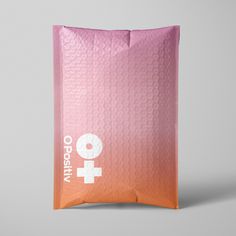 an orange and pink bag with the word occity printed on it's side