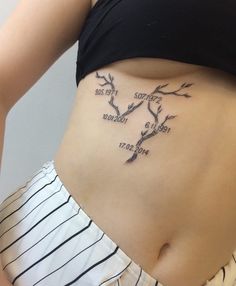 a woman's stomach with three branches on it and the words love written in cursive font