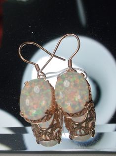 Opal earrings, Rose Gold floral filigree, Edwardian vintage jewelry, Silver Embrace jewelry Oval Opal Earrings For Formal Occasions, Elegant Oval Pendant Copper Jewelry, Elegant Copper Oval Pendant Jewelry, Victorian Filigree Oval Earrings, Formal Oval Opal Earrings, Victorian Filigree Drop Earrings, Silver Filigree Victorian Earrings, Victorian Oval Opal Jewelry, Victorian Opal Oval Jewelry