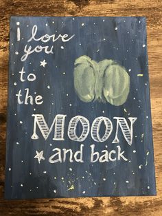 i love you to the moon and back sign painted on wood with chalkboard lettering