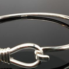 "This sterling silver Lasso Bangle is available in two finishes, sterling silver and sterling silver with 14k gold vermeil. The bangle accommodates medium and large spacer beads and traditional charms. \"Sterling\" is inscribed on the inside of the band. Brand new condition. Made by Brown County Silver. Comes in small, medium, and large sizes. Small - 6.5\" Medium - 7.25\" Large - 8\" Approximate weight is 9.7 grams See more @ https://www.etsy.com/shop/brocosi" Classic Bracelet With Sterling Silver Clasp As Gift, Adjustable White Gold Bangle With Sterling Silver Clasp, Classic Adjustable Hoop Bracelets, Sterling Silver Bangle With Lobster Clasp, Adjustable White Gold Bracelet With Lobster Clasp, Sterling Silver Clasp Bangle Bracelet, Sterling Silver Clasp Bangle For Gift, Adjustable Sterling Silver Bangle, Nickel Free Sterling Silver Classic Bangle