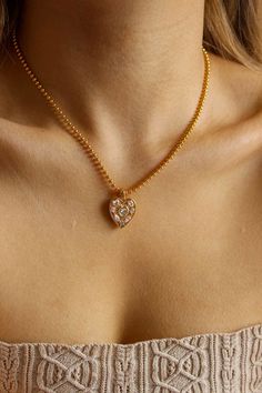 PRODUCT DESCRIPTION Embrace the timeless beauty of our Shining Heart Necklace, a meticulously crafted piece that captures the essence of love and luxury. The high-quality zircon pendant adds a touch of brilliance to your neckline, making this necklace a symbol of enduring elegance. Gold Statement Necklace Water Resistant 18k Gold-plated on High Quality Brass Length: 44cm plus 5cm adjustable chain AAA Grade Zircon Read our full Jewellery Care Guide here Read our Sizing Guide here Glamorous Heart-shaped Cubic Zirconia Jewelry, Dazzling Heart Pendant Jewelry With Sparkling Stones, Heart Cut Crystal Clavicle Chain Necklaces, Crystal Heart Cut Clavicle Chain Necklaces, Crystal Clavicle Chain Necklace With Heart Cut, Glamorous Heart Cut Jewelry Gift, Cubic Zirconia Heart Pendant Necklace With Sparkling Stones, Elegant Heart Pendant Necklace With Sparkling Stones, Crystal Heart Cut Necklace With Sparkling Stones