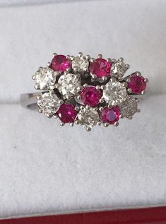 18K White Gold Ruby And Diamond Ring 6 Brilliant Cut AA quality Rubies 1ctw 8 Genuine Diamonds .88ctw SI2 clarity F Color Appraisal $8,000 Beautiful High Diamonds F color grade Rubies AA quality Gorgeous 18K Gold Ring Weighs- 5.2 grams Ring size - 7.25 Visit our shops on Etsy HauteCoutureLaLa TrendsCouture BeautifulPatina LastingTrends Combine shipping within the first three shops listedFree Shipping on orders over $35.00 however if there is a return buyer to refund seller for the free shipping Platinum Multi-stone Cluster Diamond Ring, Red Cluster Diamond Ring With Brilliant Cut, Platinum Cluster Multi-stone Diamond Ring, Cluster Ruby Ring With Brilliant Cut Diamonds, Ruby Ring With Diamond Cluster And Brilliant Cut, White Cluster Multi-stone Diamond Ring, Red Diamond Cluster Ring With Vvs Clarity, Platinum Multi-stone Cluster Ring, White Gold Cluster Diamond Ring With Multi-stone