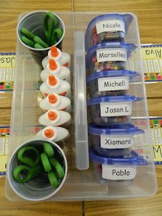 several plastic containers filled with different types of food