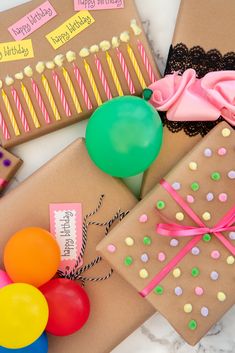 birthday presents wrapped in brown paper with balloons