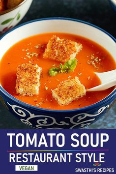 a bowl of tomato soup with croutons in it and the words tomato soup restaurant style