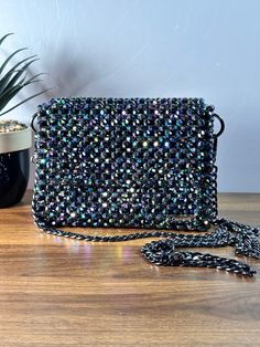 Dazzling nights call for an exquisite companion. This beaded evening bag adds the perfect touch of glamour to your ensemble. Dimension: Width: 18cm Height: 13cm Depth: 6cm The bag comes with two detachable handles. Feel free to contact me for any questions. Glamorous Beaded Evening Bag, Embellished Handheld Evening Bag, Handheld Embellished Evening Bag, Rectangular Shoulder Bag With Sequins For Night Out, Rectangular Sequin Shoulder Bag For Night Out, Beaded Evening Shoulder Bag, Handheld Evening Shoulder Bag With Phone Pocket, Embellished Handheld Clutch For Evening, Silver Crossbody Evening Bag For Party