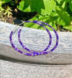 The photos and video show 45mm hoops. Sparkly, dainty and lightweight round hoop earrings featuring high quality tiny (2mm) sparkly metallic Czech and Japanese glass beads in shades of dark royal amethyst purple. The beads are strung unto strong 21 gauge .925 Sterling Silver wire. To extend the life of the beads finish, I 'duracoat' them in my studio. Silicone bead 'bumpers' are added to keep the bead layout in place. You have an option to add French hooks. You have a choice of 25mm, 35mm, 45mm, 55mm, 65mm or 75mm diameter hoops. More HOOP EARRINGS, in my shop: https://www.etsy.com/shop/DorotaJewelry?ref=hdr_user_menu-shop§ion_id=28150357 --- Please, keep in mind that the jewelry in the photographs looks larger than it does in person. I post close up pictures to show the details in the jew Bead Hoop Earrings, Dark Amethyst, Amethyst Purple, Beaded Hoop Earrings, Beaded Hoops, Royal Purple, Silicone Beads, Earrings Sterling Silver, Jewelry Earrings Hoops