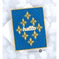 a greeting card with the word hello written on it in gold and blue, surrounded by small flowers