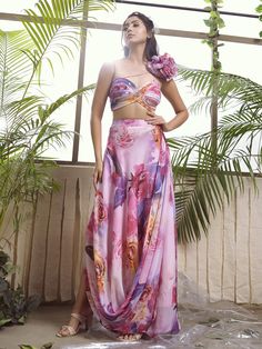 A two-piece co-ord set from the Suruchi Parakh collection. This beautiful pink floral bustier is paired with a draped skirt. The Haputai silk co-ord set is perfect for any summer event. The pink skirt is enhanced with the floral print and graceful drape. The twisted top has a flower on one shoulder, padding, and a back hook opening. Pink Bustier, Pool Party Dresses, Co Ords Outfits, Pool Party Outfits, Draped Skirt, Party Wear Indian Dresses, Stylish Dress Book, Stylish Dresses For Girls, Indian Designer Outfits