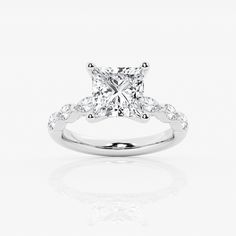 a princess cut diamond engagement ring on a white background