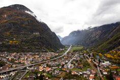 an aerial view of a town surrounded by mountains