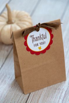 a brown paper bag with a tag that says, thank you for you