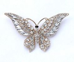 Large dazzling crystal gold butterfly brooch jewelry, which can be used for your DIY project - gold wedding, bridal jewelry, bridesmaid dress decor, broach bouquet, ring pillow, invitations, cake decorations, event decor, crafts, scrap booking and much more! Size: 2 1/2 inch high 3 1/2 inches wide Stone color: Crystal clear Metal: Gold tone plated This gold rhinestone butterfly broach can be ordered with pin in the back to add to wedding gown or dress sash, to wire into brooch bouquet, or any number of other craft projects; or without the pin as a flat back embellishment for your sew-on, glue-on DIY project. More GOLD brooches - https://www.etsy.com/shop/Crystalitzy?section_id=16137618&ref=shopsection_leftnav_2 Please note that this crystal rhinestone embellishment has flat backing, it is Dress Brooch, Dress Crystal, Brooch Dress, Bouquet Brooch, Golden Butterfly, Butterfly Wedding, Dress Sash, Brooch Bouquets, Large Crystal