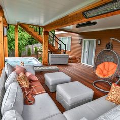 a living room with couches, chairs and a hot tub