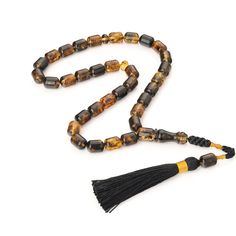 A special rosary made of amber. Unique and One of kind Islamic amber rosary. Inclusions of ancient nature and fauna are visible in amber. Amber rosary are collected on high quality thread with a unique handmade custom designed tassel. The rosary is carefully crafted from high quality amber. The rosary looks perfect and will be a beautiful accessory giving the natural energy and warmth of Amber. Tasbih gives an incredibly pleasant feeling. This special Islamic prayer beads is the perfect gift for you and loved ones. Weight rosary: 27 g Size Amber Beads: 0,35x0,47in (9 x 12 mm)  Imam size: 1,37in (35 mm) Length rosary with imam: 9,4in (24 cm) Looking for a Meaningful Gift - this is an excellent choice! For a gift for the love of a loved one or just for yourself. You buy a high-quality Amber Spiritual Amber Beads For Jewelry Making, Adjustable Amber Handmade Rosary, Adjustable Amber Spiritual Rosary, Traditional Amber Rosary With 8mm Beads, Adjustable Amber Rosary As Gift, Spiritual Amber Rosary For Healing, Amber Spiritual Rosary For Healing, Amber Spiritual Healing Rosary, Amber Rosary With 8mm Beads In Spiritual Style