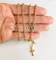 18k gold filled divine child rosary. baby jesus for protection, health and good luck. the cross may vary. 18k gold filled rosario del divino nino jesus. para protección, salud y buena suerte. Yellow Gold Rosary With Miraculous Medal As Gift, Gold Spiritual Rosary With Miraculous Medal, Gold Cross Rosary Spiritual, Gold Cross Rosary In Spiritual Style, Gold Spiritual Rosary With Cross, Spiritual Gold Rosary Bracelet For Blessing, Gold Cross Rosary, Yellow Gold Cross Rosary As Gift, Gold Spiritual Rosary Bracelet For First Communion