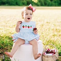 Two outfits in one! The Reversible Smocked Strawberry and Crab Bubble features a button on reversible bib top. Over the top girly details, three rows of adorable bum ruffles trimmed in ric rac and a giant bow on the back - this bubble is the perfect piece for the season! Features & Fit: snaps in stride for easy diaper changes three rows of bum ruffles trimmed in ric rac reversible button on bib - one side features smocked strawberries and the reverse side features an applique crab jumbo bow on b Playful Bubble Romper With Smocked Back, Cute Cotton Bubble Romper With Smocked Bodice, Playful Gingham Bubble Romper For Playtime, Spring Smock Bubble Romper For Playtime, Spring Bubble Romper With Smock For Playtime, Spring Playful Bubble Romper With Smocked Bodice, Playful Bubble Romper With Smocked Bodice For Spring, Playful Cotton Bubble Romper With Smocked Back, Spring Bubble Romper With Smocked Bodice