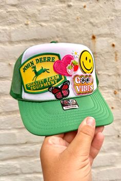 A Wild Bohemian exclusive! One of a kind, trucker hat with patches to match your own unique style! Adjustable snap back closure. Lightweight & breathable mesh back. Made with a durable foam material Trucker Snapback Hat With Patches For Summer, Fun Snapback Trucker Hat With Patches, Adjustable Green Trucker Hat With Logo Patch, Multicolor Trucker Hat, Fun Green Trucker Baseball Cap, Green Fun Snapback Trucker Hat, Green Snapback Hat With Embroidered Patch, Green Trucker Hat With Logo Patch, Green Snapback Trucker Hat With Logo Patch