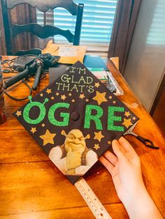 a graduation cap that says i'm glad that's ogre on it