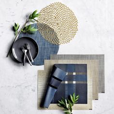 placemats, napkins and utensils laid out on a table