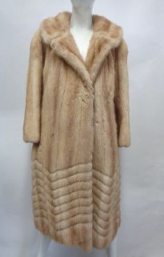 "BEAUTIFUL & VERY STYLISH CANADIAN PASTEL MINK FUR COAT FOR WOMEN! IT IS MADE FROM FULLY LET OUT FUR SKINS, THE BEST! IT IS ACCENTUATED WITH CHEVRON FUR DESIGN AT THE BOTTOM. THE COLLAR TYPE IS \"NOTCH\", IT CLOSES WITH FRONT HOOK & EYE CLOSURES AND HAS TWO SIDE POCKETS. THIS ITEM IS PRE-OWNED: THE FUR IS \"MINT\", THE SECOND BEST CONDITION AND THE INSIDE LINING IS \"EXCELLENT\", THE BEST CONDITION POSSIBLE! AFTER BUYING THIS ITEM, IT WOULD BE VERY MUCH APPRECIATED IF YOU COULD PROVIDE YOUR HEIG Classic Fitted Long Sleeve Fur Coat, Classic Beige Long Sleeve Fur Coat, Classic Fitted Fur Coat For Formal Occasions, Classic Long Sleeve Beige Fur Coat, Fitted Mink-colored Fur Coat For Spring, Long Sleeve Fur Coat For Spring Formal Occasions, Formal Long Sleeve Fur Coat For Spring, Spring Formal Long Sleeve Fur Coat, Formal Spring Long Sleeve Fur Coat