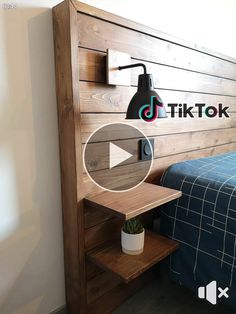 a wooden headboard with the tiktok logo on it and a bed in the background