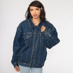 "Vintage 80s jean jacket in blue denim with a faux shearling lining. Every garment we sell is authentic vintage and one-of-a-kind! You will receive the exact item photographed. Condition: Very good vintage with light general wear. Best fits women's: Extra Large Best fits men's: large Material: denim with sherpa lining MEASUREMENTS Taken from seam to seam while the garment is lying flat. Double the armpit, waist, and hips For reference, model is 5'10\" and measures 31-23-34. Length from Top: 27\" 80s Jean Jacket, 90s Jean Jacket, Denim Sherpa Jacket, 90s Jean, 80s Jeans, Biker Coat, 80s Denim, Jacket Denim, Sherpa Jacket