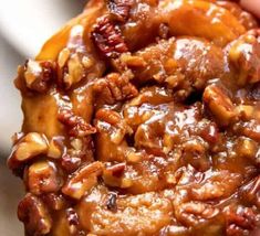 a close up of a doughnut with nuts on it