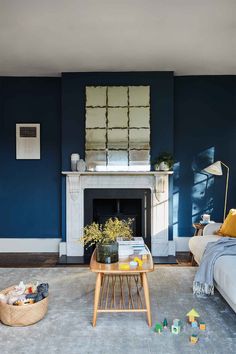 a living room with blue walls and furniture