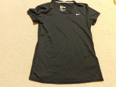 NIKE BLACK DRI-FIT TOP SHIRT SIZE MEDIUM This is used woman short sleeve dri fit shirt by Nike in very good condition , regular fit. size medium, measurements : armpit to armpit 17.5" ( circle 35"), total length : 24.5", shoulder to shoulder: 16", sleeve opening: 6.5", black color, Nike logo on left front,  100% polyester, made in Honduras, please check photos for detail.   FREE SHIPPING IS FOR US AND APO ADDRESS ONLY!!! I only ship to the address provided by Paypal. Please make sure that your i Nike Fitted Sports Shirt, Nike Fitted Shirt For Sports, Fitted Nike Sports Shirt, Fitted Nike Shirt For Sports, Nike Short Sleeve Training Tops, Nike Dri-fit Moisture-wicking Top, Nike Sporty Moisture-wicking Shirt, Nike Dri-fit Short Sleeve Tops, Nike Dri-fit Tops For Sports Season