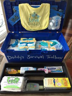 an open suitcase with baby items in it