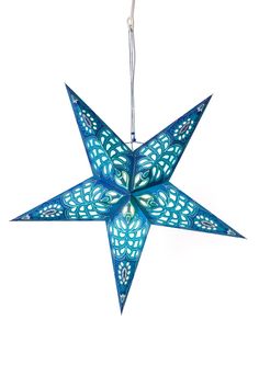 a blue ornament hanging from a string on a white background with the shape of a star