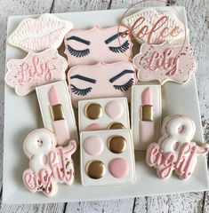 some cookies and makeup are on a plate